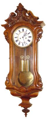 C.1875, Austrian, 2-Wt Dwarf, Carved Serpentine case, 8-day gong striking (short case and pendulum with full 7 inch dial). — Antique Clocks Price Guide