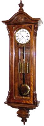 C.1865, Austrian, 3-Wt Grand Sonnerie Vienna Regulator, in a slender walnut case with serpentine influence. — Antique Clocks Price Guide