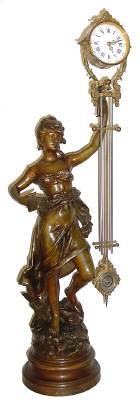 C.1885, French, Large Canister Swing Clock, a patinated spelter statue of MUSIC, holding aloft a large arm with porcelain dial, the well made movement with the imprint of Guilmet, and serial No. 1590. — Antique Clocks Price Guide
