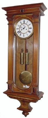 C.1910, German, Gustav Becker, 2-Wt, rod strike Vienna Regulator, in a walnut case with grooved pilasters on the door, less top and missing a couple of small moldings. — Antique Clocks Price Guide