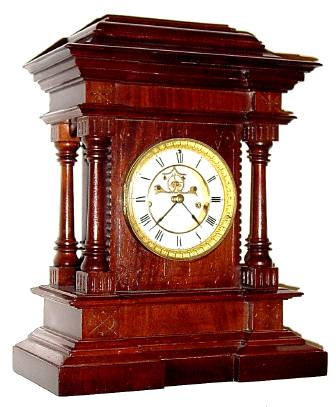C.1889, E. N. Welch Mfg Co., "Norma" 8-day time and strike mantel clock in mahogany, French sash with beveled glass. — Antique Clocks Price Guide