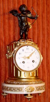 C.1870, French, Ormolu and Marble, mantel clock, CUPID, with a quiver of arrows at his feet, 8-day time and bell strike. — Antique Clocks Price Guide