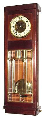 C.1910, German, Gustav Becker 2-Weight, 8-day time and strike wall clock in a mahogany art Deco case, with ribbed brass pattern on dial center, weights and pendulum. — Antique Clocks Price Guide