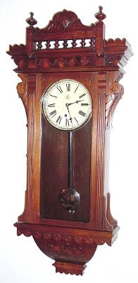 C.1885, Waterbury Clock Co., "QUEBEC", Walnut cased wall clock, 8-day timepiece. — Antique Clocks Price Guide