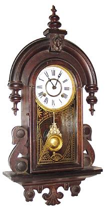 C.1917, New Haven Clock Co., CUBA, Hanging gingerbread in dark mahogany finish, 8-day time and strike. — Antique Clocks Price Guide