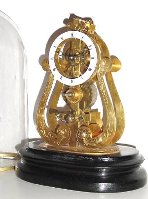 C.1880, French, Skeleton Clock and Dome, 8-day with 24 hour alarm disc and engraved front plate and base. — Antique Clocks Price Guide