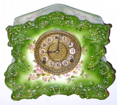 C.1904 William L. Gilbert Clock Co., "No. 432", 8-day time/strike porcelain mantel clock in green with pink flowers. — Antique Clocks Price Guide