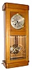 C.1910, German, Gustav Becker, 8-day time and strike wall clock in a cherry art Deco case with heavy beveled glass.