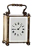 C.1930, French, Brass Cased Timepiece Carriage clock, of inexpensive quality, with glass only on the front, sheet brass to the sides and rear, with travel case.