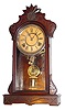 C.1885, Mixed Lot: A Gilbert ARGUS walnut case, now with a signed Kroeber C.1875 (pat Oct 6, 1870) time and strike movement, gong and pend.