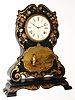 C.1850, Litchfield Mfg Co, Papier-mache case with original decorations and mother of pearl, and with a "molded in" shelf at the bottom, similarly decorated, with original 8-day time and strike movement (signed Chauncey Jerome)