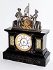 C.1895, Ansonia Clock Co., MECHANICAL CLOCK, 8-day time and strike, enameled iron case with cast metal sailors, the ships wheel rocking back and forth.