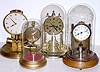A Lot of Four Clocks: 1) Barr Mfg, Battery timepiece and glass dome, with incorrect pendulum;