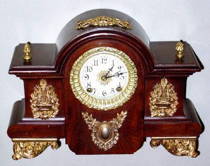 C.1904, Ansonia Clock Co., NY, "Louvre", 8-day time + strike enameled iron case mantel clock (wrong top trim). — Antique Clocks Price Guide