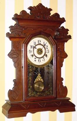C.1890, New Haven Clock Co., "Coquette" , 8-day time/strike mantel clock in black walnut. — Antique Clocks Price Guide