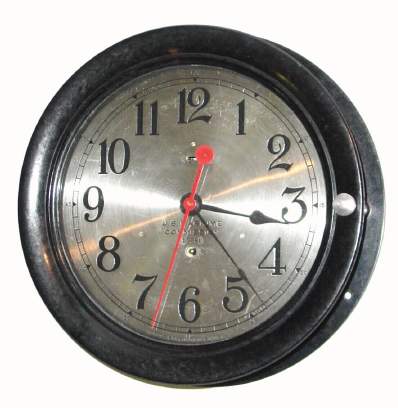 C.1950, Seth Thomas, for the U. S. Maritime Commission, serial No. 17289, ship's engine room clock, black bakelite case with hinged bezel and thumbscrew latch. — Antique Clocks Price Guide