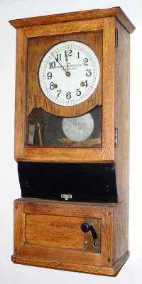 C.1925, Cincinnati Time Recorder, Cincinnati, Ohio, oak cased card punch clock with original door key. — Antique Clocks Price Guide