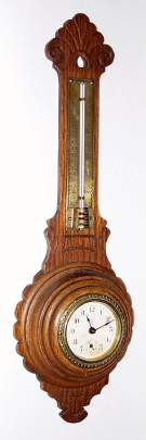 C.1900, Waterbury Novelty, Clock-Barometer in an oak wall case, and with Fahrenheit thermometer, marked for Blood Heat, Temperate, Freezing and Zero on a brass scale. — Antique Clocks Price Guide