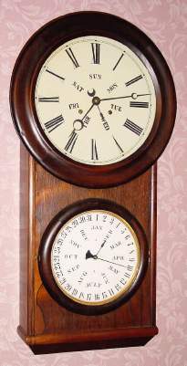 C.1865, L.F. and W.W. Carter, time and strike double dial, perpetual calendar wall clock, similar to the Lewis Calendar No. 2, two weights, 8-day. — Antique Clocks Price Guide