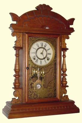 C.1889, E. N. Welch, Forestville, Conn, Walnut Cased GOUNOD, gingerbread clock with top from another piece of walnut furniture. — Antique Clocks Price Guide