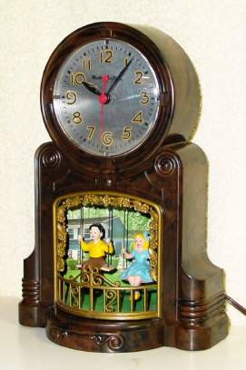 C.1950, MasterCrafters Clock Corp, Chicago, Ill SWINGING PLAYMATES, Model 551, 110v timepiece, a boy and girl swinging side by side, each the opposite direction of the other. — Antique Clocks Price Guide