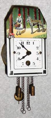 C.1935, German, "Swiss Clock Co", Mini Pendulette, RED RIDING HOOD, with porcelain dial, — Antique Clocks Price Guide
