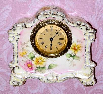 C.1900, Ansonia Clock Co., NY, "Bluebird" , 30-hour porcelain timepiece. — Antique Clocks Price Guide
