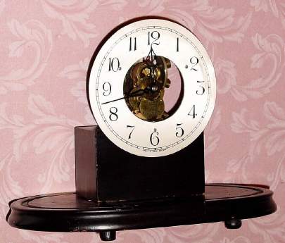 C.1909, Eureka Clock Co., Ltd, London, Battery timepiece MOVEMENT, serial No. 4351, mounted to a wooden base. — Antique Clocks Price Guide
