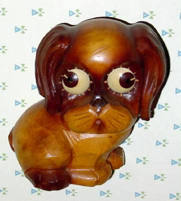 C.1935, German, Oswald, Small Carved Wood DOG, linden with light brown coloration, standard size eyes. Time indicated by position of the pupil. — Antique Clocks Price Guide