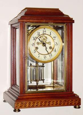 C.1913, Waterbury Clock Co., Waterbury, Conn, CHER , crystal regulator, inlaid mahogany case, with faux mercury pendulum. — Antique Clocks Price Guide