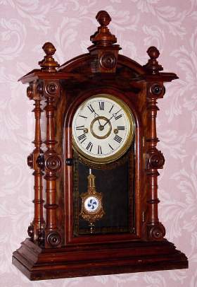 C.1875, E. N. Welch, Forestville, Conn, "PATTI, V.P." , 8-day time and strike mantel clock in rosewood with sandwich glass pendulum. — Antique Clocks Price Guide