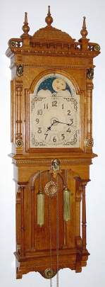 C.1894, Seth Thomas Clock Co., "JUPITER", 2-weight, 8-day wall clock in oak, rolling moon dial with bell strike. — Antique Clocks Price Guide