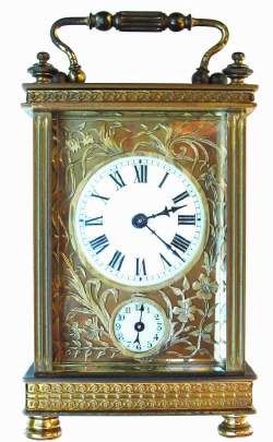 C.1910, French Brass Cased Carriage clock, time and alarm with a floral mask. — Antique Clocks Price Guide