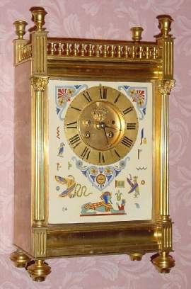 C.1885, French, S. Marti, Gilt bronze mantel clock, 8-day gong strike, with unusual porcelain plaque dial with Egyptian decorations, open escapement. — Antique Clocks Price Guide