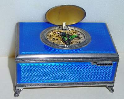 C.1940, Swiss, Singing Bird Box, guilloche enamel [blue] over patterned silver base. — Antique Clocks Price Guide
