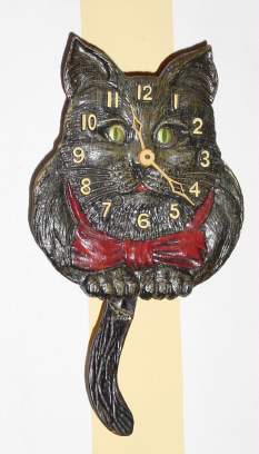 C.1937, Lux Clock Mfg. Co., Waterbury, Conn., "Cat D243", 30-hour novelty timepiece, black. — Antique Clocks Price Guide