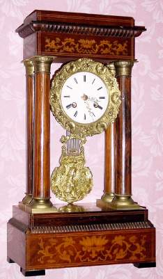 C.1880, French, Marti et Cie, 4-Column EMPIRE , style mantel clock, 8-day bell strike in a rosewood inlaid case. — Antique Clocks Price Guide
