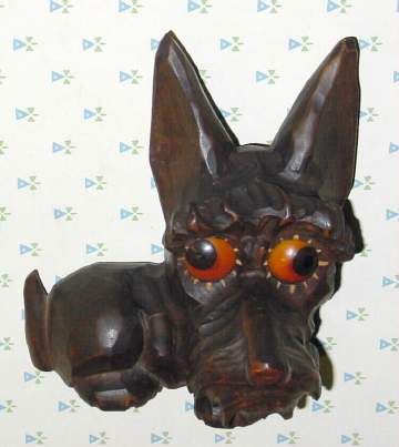 C.1932, German, Oswald, Carved Wood SCOTTY, one day novelty, time indicated by the position of the eyes. — Antique Clocks Price Guide