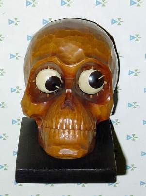 C.1932, German, Oswald, Carved Wooden SKULL, one day novelty, time indicated by the position of the pupils of the eyes. — Antique Clocks Price Guide