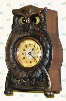 C.1900, German, Junghans, Animated "OWL" Timepiece (eyes cross and uncross), one day duration, wooden case box with cast metal owl body attached at front. — Antique Clocks Price Guide