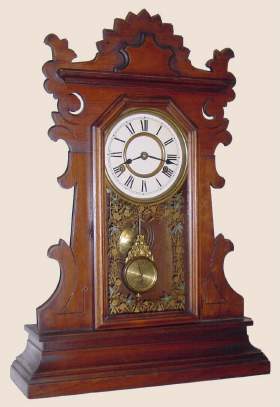C.1890, New Haven, Black Walnut SHAMROCK, 8-day, time and strike gingerbread clock. — Antique Clocks Price Guide
