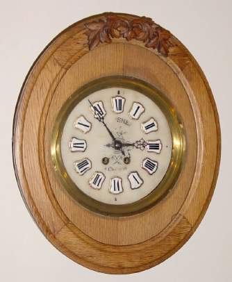 C.1890, French, Picture Frame Clock, oak frame with carved leaves at top, with alabaster dial and signet numerals, gong strike, 8-day. — Antique Clocks Price Guide