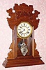  C.1893 Waterbury Clock Co., "Norwalk", 8-day time and strike mantel clock, in walnut, less glass. 