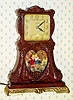  C.1950, United Metal Goods Mfg, Brooklyn, NY, BOY and GIRL ON SWING, 110v electric automaton timepiece in a plastic molded case, with heart shaped opening below the dial. 