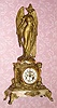  C.1900 Waterbury Clock Co., [?] figural clock, iris theme, 8-day time and gong strike onyx and cast white metal. 