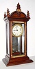  Mixed lot: Time train from an A. D. Crane Year movement, now set into a new set of plates, mounted into a Victorian display cabinet, with a metal panel in the lower section. 