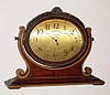 C.1927, Waltham Watch Co., Waltham, Mass , Easel clock, of walnut, attractively carved, waterfall design. 