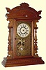  C.1889, E. N. Welch, Forestville, Conn, Walnut Cased GOUNOD, gingerbread clock with top from another piece of walnut furniture. 