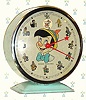  C.1965, Bayard, France, "Pinocchio" , 30-hour novelty alarm timepiece, bound up (designed for disc with Jimminy Cricket to rock back and forth as clock runs.