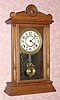  C.1910, Sessions Clock Co., Forestville, Conn, "EIFFIEL" , oak cased mantel clock with printed tablet, 8-day time and gong strike. 